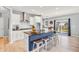 Modern kitchen with stainless steel appliances, granite countertops, a center island with barstool seating, and lots of space at 5353 Hibiscus Dr, Plainfield, IN 46168