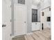 Convenient mud room area near the entry with storage cabinets, stylish decor, and sleek design at 5353 Hibiscus Dr, Plainfield, IN 46168