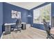 Comfortable home office with ample workspace, natural light, and modern desk setup for productivity and focus at 5353 Hibiscus Dr, Plainfield, IN 46168