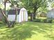 Large backyard includes a shed and mature trees, offering ample space to enjoy at , Indianapolis, IN 46218