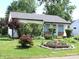 Charming single-story home with well-maintained landscaping and flower beds at , Indianapolis, IN 46218