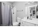 Well-lit bathroom with a shower-tub combo, modern fixtures, and a clean vanity for comfortable living at 630 Dorman St, Indianapolis, IN 46202