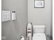 This half-bath is updated with a modern toilet and neutral tones at 630 Dorman St, Indianapolis, IN 46202