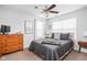 This bedroom features a ceiling fan, neutral tones, and ample natural light at 630 Dorman St, Indianapolis, IN 46202