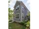 Two-story home with gray siding, white trim, and mature landscaping at 630 Dorman St, Indianapolis, IN 46202