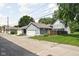 View of garages in a backyard setting, showcasing the property's convenient parking and storage solutions at 630 Dorman St, Indianapolis, IN 46202