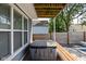 Exterior view of a covered hot tub on a wood deck with a privacy fence at 630 Dorman St, Indianapolis, IN 46202