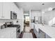 Modern kitchen with stainless appliances, large island and ample counter space for cooking prep at 630 Dorman St, Indianapolis, IN 46202