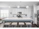 Bright kitchen features a large center island with seating, modern appliances, and stylish pendant lighting at 630 Dorman St, Indianapolis, IN 46202
