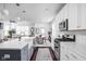Open-concept kitchen boasts an island, stainless steel appliances, and seamless flow to the dining and living areas at 630 Dorman St, Indianapolis, IN 46202