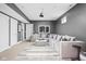Cozy living room featuring a large sectional sofa, stylish rug, and ample space for entertaining guests at 630 Dorman St, Indianapolis, IN 46202