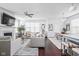 Bright open-concept living room with hardwood floors, modern decor, and ample natural light at 630 Dorman St, Indianapolis, IN 46202