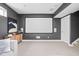 Spacious media room with a large blank projection screen, perfect for Gathering movie nights and entertainment at 630 Dorman St, Indianapolis, IN 46202