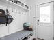 Functional mudroom features built-in storage, a bench, and hooks for organization at 630 Dorman St, Indianapolis, IN 46202
