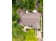 Aerial view of a well-maintained home featuring a large roof, backyard deck, and lush greenery at 6379 Monitor Dr, Indianapolis, IN 46220