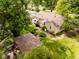 Aerial view of the backyard showcases a gazebo, landscaped garden, patio seating, and well-maintained lawn at 6379 Monitor Dr, Indianapolis, IN 46220