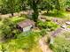 Aerial of backyard featuring various buildings, yard decor, and shade trees at 6379 Monitor Dr, Indianapolis, IN 46220