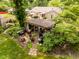 Aerial view of the backyard featuring an outdoor gazebo, patio with grill and seating, and garden at 6379 Monitor Dr, Indianapolis, IN 46220