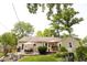 The backyard features mature trees and a well manicured lawn at 6379 Monitor Dr, Indianapolis, IN 46220