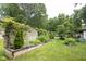 A beautiful backyard with greenery and a charming fence provides a serene outdoor space at 6379 Monitor Dr, Indianapolis, IN 46220