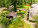Aerial view of a serene backyard with a gazebo, shed, lush greenery, and well-maintained landscaping at 6379 Monitor Dr, Indianapolis, IN 46220