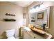 Charming bathroom with a unique vessel sink, a tiled floor, and vintage fixtures at 6379 Monitor Dr, Indianapolis, IN 46220