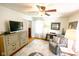 Comfortable bedroom with a ceiling fan, dresser, area rug, desk, and natural light from the window at 6379 Monitor Dr, Indianapolis, IN 46220