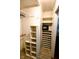 Functional walk-in closet with rods, shelving, and a personal safe at 6379 Monitor Dr, Indianapolis, IN 46220