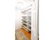 Spacious walk-in closet with built-in shelves and ample storage space, complemented by a stylish area rug at 6379 Monitor Dr, Indianapolis, IN 46220