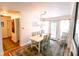 Bright dining room with stylish chandelier, seating for six, and walkout to back yard at 6379 Monitor Dr, Indianapolis, IN 46220