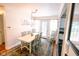 Bright dining room with stylish chandelier, seating for six, and walkout to back yard at 6379 Monitor Dr, Indianapolis, IN 46220