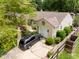 Aerial view of home showcasing a large roof, attached garage, and well-maintained yard at 6379 Monitor Dr, Indianapolis, IN 46220