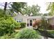 Well-maintained home features vibrant landscaping, enhancing curb appeal and a welcoming entrance at 6379 Monitor Dr, Indianapolis, IN 46220