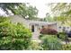 Attractive home with a lush landscaped yard and a welcoming front entrance at 6379 Monitor Dr, Indianapolis, IN 46220