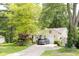 Charming beige home with a one car garage and a well-maintained lawn at 6379 Monitor Dr, Indianapolis, IN 46220