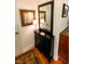 Hallway features a black foyer table with a large mirror and ornate gold framed artwork at 6379 Monitor Dr, Indianapolis, IN 46220