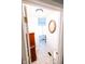 Bright hallway featuring neutral tile, an antique cabinet, and an oval framed picture on the wall at 6379 Monitor Dr, Indianapolis, IN 46220