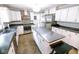 Updated kitchen with stainless steel appliances, center island, and ample countertop space at 6379 Monitor Dr, Indianapolis, IN 46220
