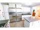 Bright kitchen features stainless steel appliances, an island, and ample white cabinetry at 6379 Monitor Dr, Indianapolis, IN 46220
