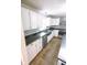 Updated kitchen with stainless steel appliances, granite countertops, and ample cabinet space at 6379 Monitor Dr, Indianapolis, IN 46220