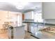 Kitchen with stainless steel appliances, ample counter space, and a view into the dining area at 6379 Monitor Dr, Indianapolis, IN 46220
