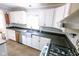 Updated kitchen with stainless steel appliances, granite countertops, and ample cabinet space at 6379 Monitor Dr, Indianapolis, IN 46220
