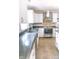 Well-lit kitchen with stainless steel appliances and ample counter and cabinet space at 6379 Monitor Dr, Indianapolis, IN 46220
