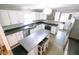 Updated kitchen with stainless steel appliances, center island, and ample countertop space at 6379 Monitor Dr, Indianapolis, IN 46220