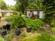 A view of the garden and landscaping that features a gazebo with curtains at 6379 Monitor Dr, Indianapolis, IN 46220