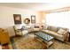 Bright living room with light-colored furniture, a patterned rug, and lots of natural light at 6379 Monitor Dr, Indianapolis, IN 46220