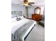 A calming bedroom with a ceiling fan, wooden dresser, and a serene atmosphere at 6379 Monitor Dr, Indianapolis, IN 46220