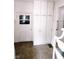 A mudroom featuring white cabinets, an exterior door, and an access door at 6379 Monitor Dr, Indianapolis, IN 46220