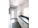 Bright mudroom boasts ample cabinet space, a granite countertop, and an exterior door for convenience at 6379 Monitor Dr, Indianapolis, IN 46220
