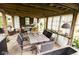 Relaxing outdoor living area with comfortable seating, dining space, and a charming pergola at 6379 Monitor Dr, Indianapolis, IN 46220
